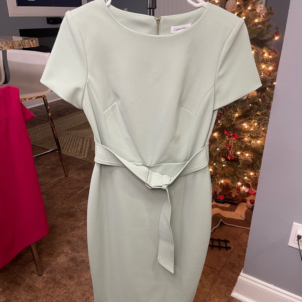 Knee length dress, light green color, perfect for work at the office. Little use